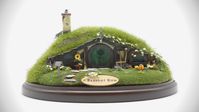 Experience the magic of the Shire with this adorable Hobbit House. This enchanting miniature is a must have for any lover of Lord of the Rings or fantasy lore.