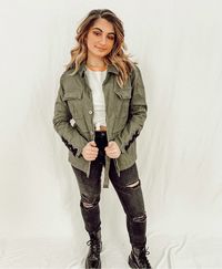 You'll be ready for your next adventure in the What It Takes Olive army Jacket. Classic military jacket that sure to become a closet staple.  Just the right amount of edgy weather you're walking up to you friends or they're watching you walk away! Olive twill fabric forms a field jacket bodice with draw-string adjustable waist, patch pockets, lace-up sleeves and back