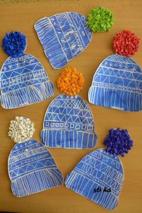 Winter hats craftivity. Draw designs with white crayon, then paint over with watercolor. These would make an adorable bulletin board!