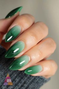 Go for a gradient effect with these green acrylic nails. The seamless transition from dark green to light green creates a mesmerizing look that's sure to impress. Great for everyday wear. Find more stunning designs at nailhow.com. Save this pin now!