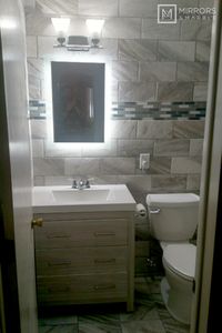 A stunning home bathroom install of a side-lighted LED rectangular mirror. This backlit 20" by 28" mirror brings this beautifully tiled and remodeled bathroom to life. The design is perfect! Huge thank you to Sharon, from Warren, OH, for sharing this inspirational work!