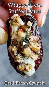 22 reactions | WHIPPED HERBED FETA STUFFED DATES!! Topped with a honey-pecan-basil crunch—these are 💣 By @starinfinitefood ✨  8 oz pitted Medjool dates 6 oz feta cheese ½ cup Greek yogurt ⅓ cup chopped parsley  Juice of ½ lemon  ¼ tsp salt Pepper to taste ½ cup toasted pecans, finely chopped ⅓ cup finely chopped fresh basil  1 tbsp honey ½ tsp lemon zest ¼ tsp salt Pepper to taste • 1️⃣Make the whipped feta. Add the feta, yogurt, parsley, lemon juice, salt and pepper to a food processor. Process until smooth and set aside.2️⃣Make the topping. Add the pecans, basil, honey, lemon zest, salt and pepper to a small bowl. Mix to combine. 3️⃣Slice the dates open on one side. Add a spoonful of the feta to each of the inside of the dates. Spoon a bit of the topping to the top of the feta on each d