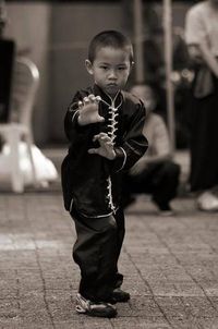 Young kid practicing kungfu Tiger claw, youth. Chinese martial arts