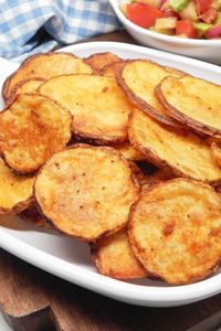 Oven-Baked Potato Slices | "Made as written and at 45 minutes I ended up with oven baked potato chips that were crispy and full of flavor." #sidedishrecipes #sides #dinnersidedish #sidedishes #sidedishideas #potatoes #potatorecipes #potatosidedish