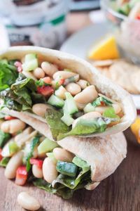 Quick & Easy White Bean Salad - An easy light lunch ready in under 10 minutes. Easily packable in a lunchbox. Serve it up in a pita, between two slices of bread, over lettuce, with crackers, or simply on it's own. Using non-dairy yogurt as the base of the sauce, it's quick, easy and super flavorful. #vegan #dairyfree #glutenfree #lunch #quickandeasy #vegetarian #sandwich #salad #meatlessmonday