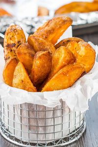 Seasoned Baked Potato Wedges - Baked in the oven, this easy, healthy recipe makes crispy, oven-fried wedges that are simply spiced and cooked to perfection. You'll also learn to cut the wedges with ease. #ErrensKitchen #potatorecipes #potatoes #potatowedges #easyrecipe #easycookingrecipes #easycooking #budgetmeals