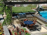 Round columns, dark trellis wood, and slightly sunked, with views of the pool.  awesome