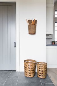 Baskets, hanging basket with rolling pins in corner of kitchen - Studio McGee Design