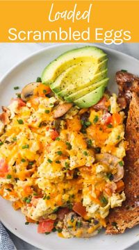 These loaded scrambled eggs are packed with veggies, cheese and bacon. Made with simple ingredients this is a hearty and delicious breakfast or brunch recipe. You can customize this recipe with your favorite protein & veggies.  #scrambledeggs #brunch #breakfastrecipe