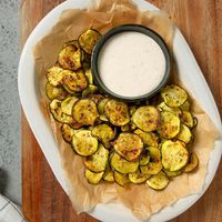 This air-fryer zucchini chips recipe turns your garden's abundance into a healthy snack. Our zucchini chips are made without breading, so they stay as thin and crispy as a potato chip.