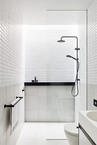 A monochromatic bathroom with black details | Concrete Conceal House by Tecture Design | Contemporary | est living