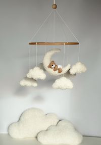 "Mobile Teddy Bear boucle Clouds Boucle Neutral gender mobile Nursery decor boucle Pregnancy gift Clouds mobile Brown bear mobile A minimalist bouclé mobile with clouds and bear is an ideal decor for a child's room for both a boy and a girl! For a child's room in any style! Made with love! 💭Materials: Korean felt American felt Hypoallergenic filler Beech wood base Boucle  💭TO ORDER If you would like to make a custom order, just message me! You can change the details of any children's mobile in