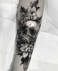 Skull surrounded by flowers, etc.