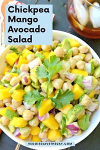 This tropical-inspired simple chickpea salad features sweet-tart mango and creamy avocado in a light, yet flavorful, dressing.