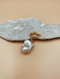 Big baroque pearl charm — easy to wear everyday and with everything. Details- Designed in Goa and Mumbai | Handmade in Jaipur- Handcrafted in 925 sterling silver with 18kt gold plating | Freshwater baroque pearl- Baroque pearls are natural and no two will look the same; they may vary in size and shape