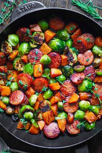 Autumn Sausage Dinner with Roasted Veggies (Butternut Squash and Brussels sprouts) in a cast iron pan.