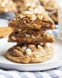 These White Chocolate Chip Biscoff Cookies are huge bakery style cookies, filled with white chocolate chips, biscoff cookie pieces, and stuffed with cookie butter in the middle. They're especially delicious served warm with the gooey cookie butter melting out as you take a bite!