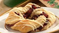 These cranberry and white chocolate pastries offer an elegant touch to any celebration.