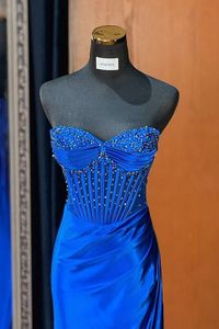 Elevate your style with our Royal Blue Mermaid Empire Ruched Beaded Party Prom Dress. Its flattering mermaid silhouette, elegant ruching, and intricate beading make this dress a stunning choice for any special occasion. Show off your curves and radiate confidence in this timeless piece.