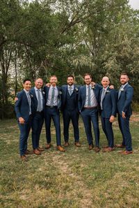 Groomsmen in Navy Blue suits for a dusty blue wedding in Fort Collins, Colorado. #dustybluewedding #navybluesuit #FortCollinsWedding