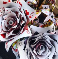 Fabulous hand crafted Playing card roses x2 + bottle vase, Alice in wonderland themed roses, poker night decor, casino themed party This listing is for two stunning hand crafted playing card roses which are made from real playing cards of a very high standard. Back of the cards is: red These make a great addition to any dinner party setting, games night, casino night or poker night. These can also be made in to hand held bouquet for weddings. These also make a great talking point and addition to