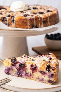 a slice of blueberry Ricotta Cake on a plate.