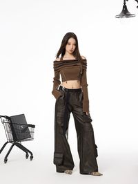 Elevate your wardrobe with these faux leather trousers, boasting a relaxed wide-leg silhouette. The design is enhanced by a stylish belt, sophisticated pleated detailing at the knees, and contemporary 3D pockets. Crafted meticulously from a luxe PU/viscose blend. Model is 5'5 10lbs wearing S