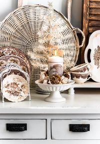 A ruffled gingham tablecloth sets the stage for a cozy cottage Thanksgiving table. Find tips below to help with stress free decorating!  Brand new ideas at DIYBeautify.com!