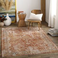 This indoor area rug infuses your space with a breezy, boho look we love. It features an array of floral-inspired designs and geometric patterns in faded hues of rust and orange color for a lived-in feel. This rug is power-loomed from polyester, giving it plenty of texture underfoot. Plus, it has a high-low pile height of 0.12", so it's great for rolling out in rooms with high foot traffic, while also being easy to clean. Even though this rug has a canvas backing, we recommend pairing it with a