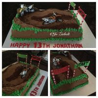 Helped my nephew create his motor cross cake