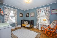 Spacious bedroom featuring hardwood floors and crown molding. Click the link for more details on 163 Claremont Ave, located in the NYC suburb of Montclair, New Jersey. #montclair #montclairrealestate #Njrealestate #Njrealtor #nycsuburb #commuter #njhomes #glenridge #bloomfield #hardwoodfloor #crownmolding #bedroom #naturallight #nursery