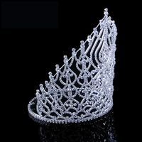 Tall luxurious complete round rimmed princess pageant tiara crown featuring an open concept with a center high point and various size crystal stone to form the pattern. material: metal, rhinestone crystal color: silver base style: 8.4 inch tall, pageant type: tiara crown