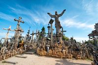 Visit the Hill of Crosses in Lithuania