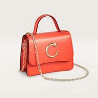 Cartier - Micro model chain bag, C de Cartier - Bag  - Panthère de Cartier micro model chain bag in tangerine calfskin, golden-finish signature Panthère logo. Interior: black lambskin, golden hot-stamped “Cartier” signature. Removable chain. Dimensions: height 90 mm x length 115 mm x depth 40 mm. Cross-body, shoulder or belt carry (with additional hook).