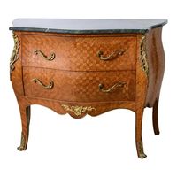 French, two drawer chest. With brass hardware and ormolu. Bowed front and scalloped front edge. Inlay check  pattern. Elegant curved legs