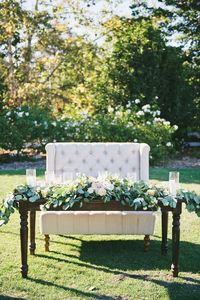 Romantic Wedding Sweetheart Table // vintage, modern, garland, blush, ivory, greenery, pillar candles, love seat, outdoor wedding, sweetheart table