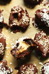 INSANELY delicious Tahini-Stuffed Dates in 4-ingredient #vegan dark chocolate! #glutenfree #tahini #dates #dessert #recipe #healthy #easy #minimalistbaker