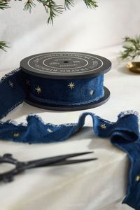 Scattered with tiny embroidered stars, this terrain exclusive velvet ribbon makes a sumptuous finishing touch for the season’s wreaths, greens, and gifts.