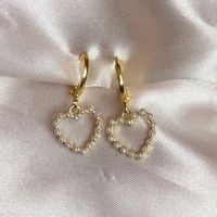 Pearl White Love heart earrings Charm size ; 11mm x 13mm Hoop size 12*12mm 18k GOLD plated Huggies.  They are 18k Gold plated so can be worn everyday and keep their gorgeous gold colour and shine, longer than your standard earring.  Shipping available for International orders * Shipped same/next business day * All earrings come in a gift pouch ✨ * Message me if you have any questions or custom requests 💕