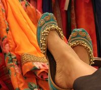 turquoise juttis, ghungroo work, gold ambis print