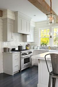 More and more homeowners are opting out of the popular all-white or wood-brown cabinet styles to try out grey painted kitchen cabinets. Why? See the answer here.