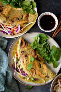 Banh Xeo are crispy and delicious Vietnamese pancakes or crepes made with a mung beans and rice base batter. In this vegan version, I use mushrooms, tofu and bean sprouts in the recipe. These are hearty, filling and protein packed. These lentil based pancakes are great alternate to omelets. Serve with spicy dipping sauce for a yummy meal of the day.