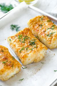 Succulent and flavorful, this delicious baked halibut is seasoned with lemon, garlic, Dijon and dill—it's the main attraction in the perfect healthy meal! | thecozyapron.com #bakedhalibut #bakedhalibutrecipes #bakedhalibutoven #bakedhalibutrecipeshealthy #bakedhalibutrecipeslemon #bakedhalibutrecipesoven