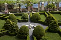 Hedges and cones of boxwood (Buxus Sempervirens L.) - Topiary art in the Italian-style monumental garden of La Cervara. Portofino, Liguria, Italy