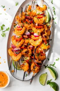 Coconut Red Curry Shrimp Skewers with bell pepper and onions are so flavorful, thanks to one of my favorite pantry staples – red curry paste. #shrimp #healthyrecipes #weightwatcherrecipes #lowcalorierecipes #healthyrecipes