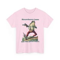 Introducing the "Strawberry Jams But My Glock Don't" Funny Tshirt from Digital Brody - the ultimate expression of quirky and cheeky fashion for those who love to stand out with their sense of humor! This funky tshirt is a hilarious top that will have everyone chuckling at its witty design. Crafted with medium fabric made of 100% cotton, this novelty wear is not only comfortable but also sustainable and highly durable for year-round enjoyment. The classic fit ensures a relaxed and comfy wear, while the crew neckline adds a neat, timeless look that can suit any occasion, be it casual or semi-formal. Featuring a fun twist on the phrase "Glock Jams," this comical tshirt is perfect for funny tshirt lovers looking to add an edgy and playful touch to their wardrobe. The tear-away label ensures a