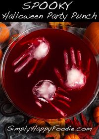 Spooky Halloween Party Punch is a fun drink to serve your guests at your Halloween Party. Scary ice sculptures make a chilling addition to this bloody delicious beverage. Halloween punch by simplyhappyfoodie.com #halloweenpartypunch #halloween