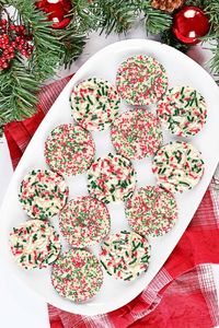 This fun Sprinkles Sugar Cookies recipe is perfect for your Christmas cookie platter! You can make them year round with other sprinkle colors.