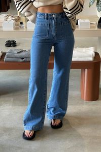 This is a super high-rise, wide leg jean, made with a rigid denim. Fabric: Soft 'worn in' lookMade with a soft touch fabricAuthentic, vintage look and feelMade with 100% cotton Sizing: Ina is 179cm tall, and wears a size 26 in denim.We suggest going a size up.