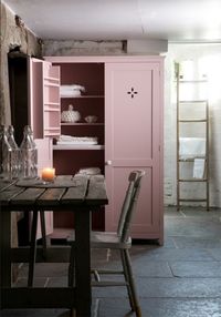 rustic style stone kitchen with rose quartz pink cupboard